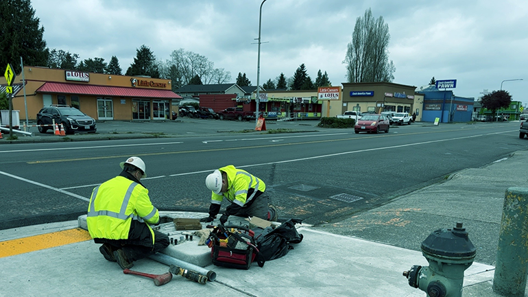 Maintenance workers on road