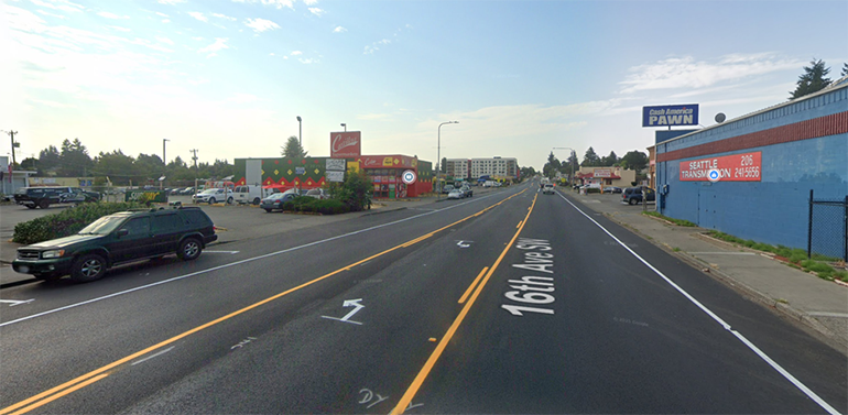 Google Maps Street View image of temporary yellow striping on gray asphalt.