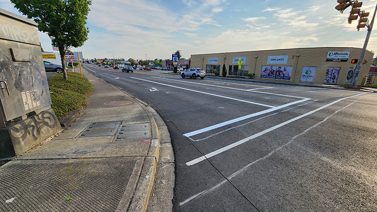 Looking north at 16th Avenue SW and SW 107th Street, there is new fresh and smooth pavement on the road