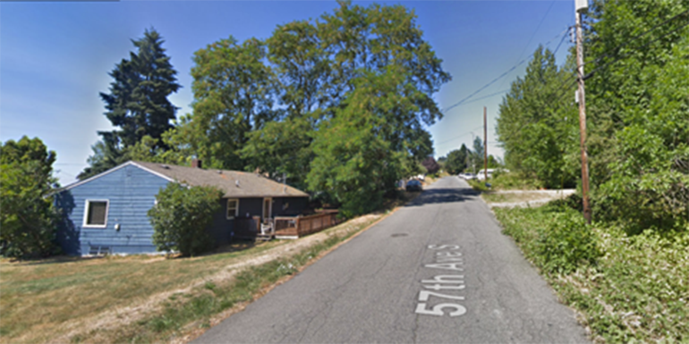 Google Maps photo of blue house along sidewalk-less stree on 57th Ave S.