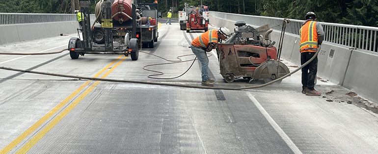 Crews saw away concrete to access the expansion joint. 