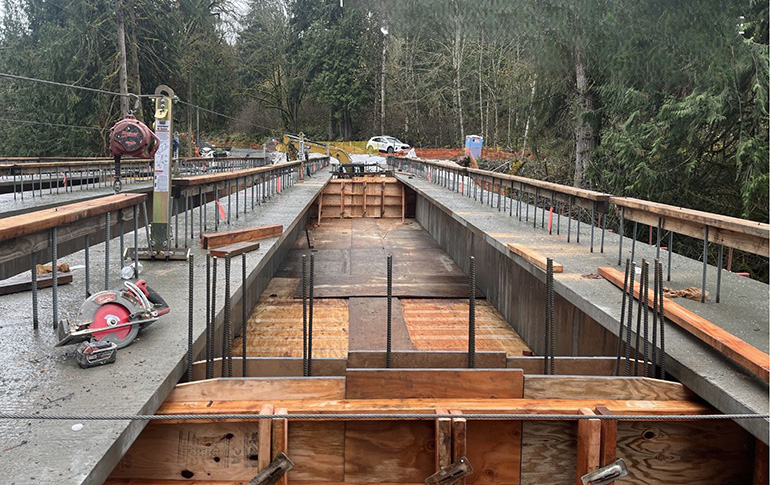 Temporary decking as workers as they prepare to pour concrete for the bridge deck.