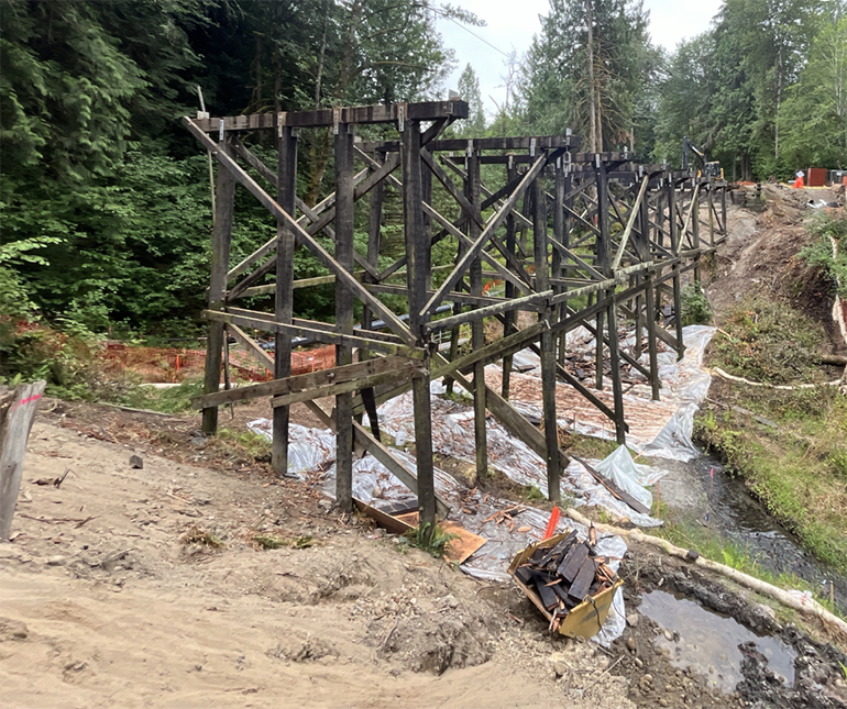 Tarping under the bridge helps to control erosion and reduce disruption to the environment.