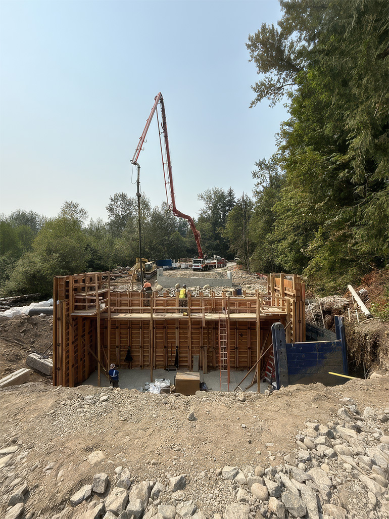 Crews working on bridge abutment