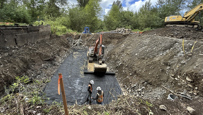 Crew members laying fabric