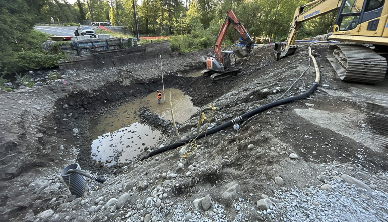 Crews excavating with heave machinery