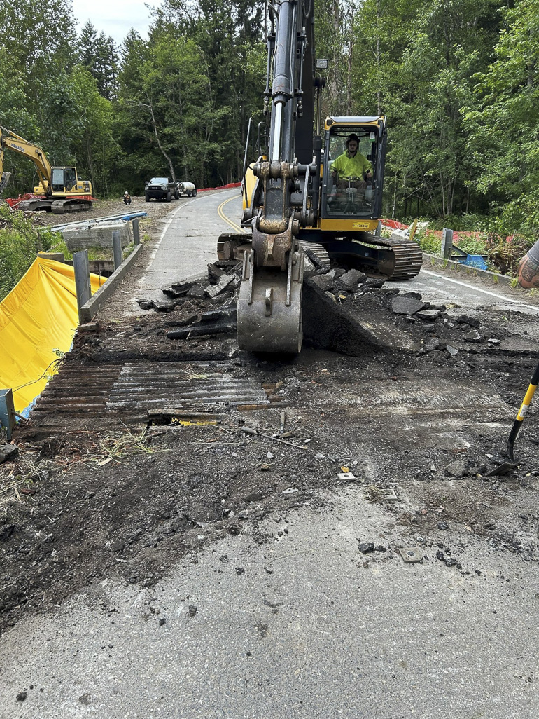 Crews demolishing bridge,