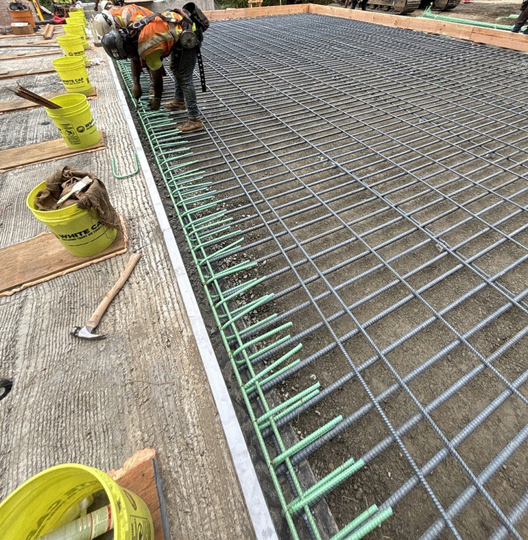 Crew member working on rebar.