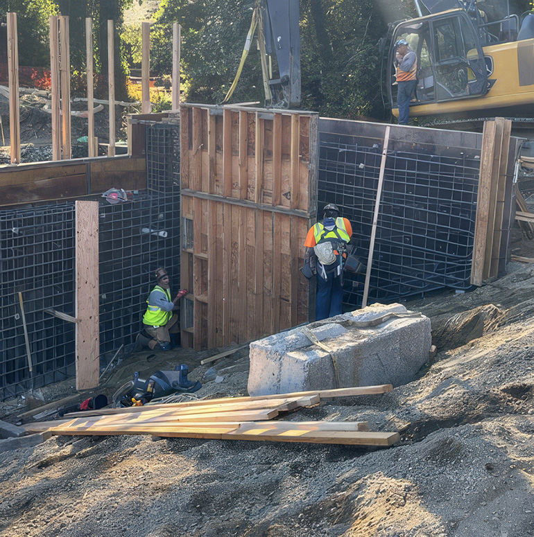 Workers working on bridge abutments