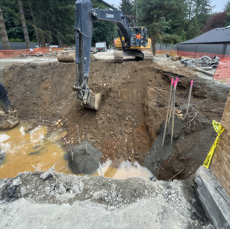 Worker digging with excavator
