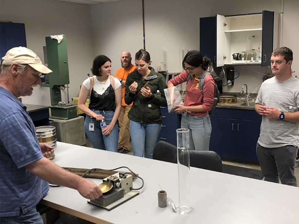 Interns visit the Materials Lab to learn about geotechnical engineering and materials testing. 