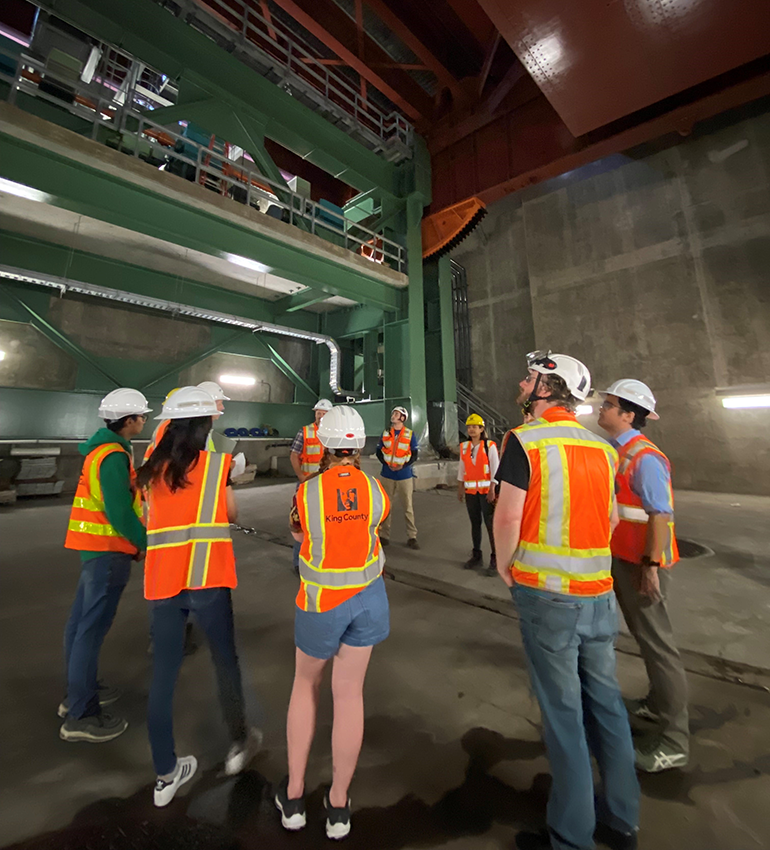 Interns on a tour of bridge operations underground.
