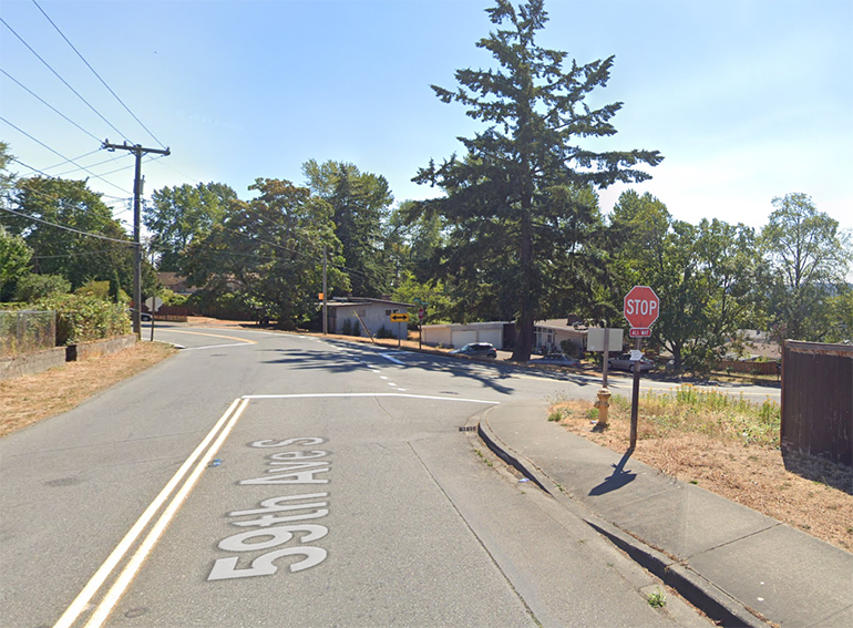 Three stop signs at the intersection of 59th Avenue S and South Langston Road