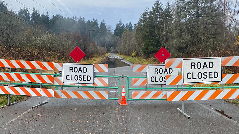 Road Closed barricades blocking road