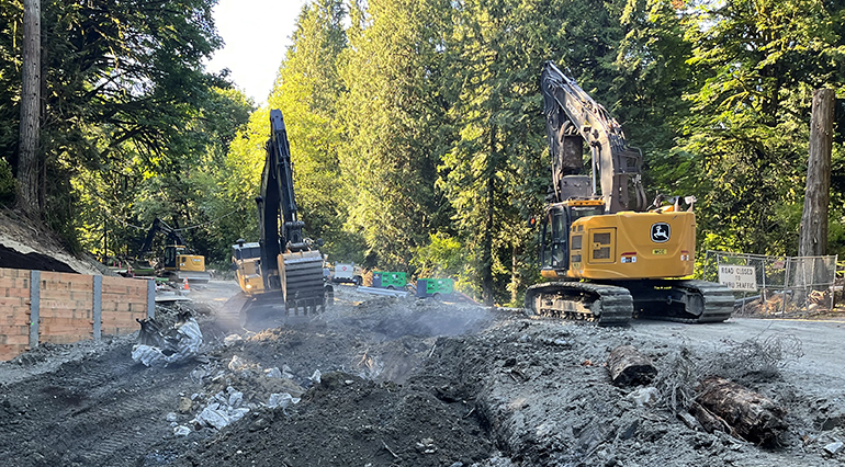 Excavators dig out the old, failing culvert.