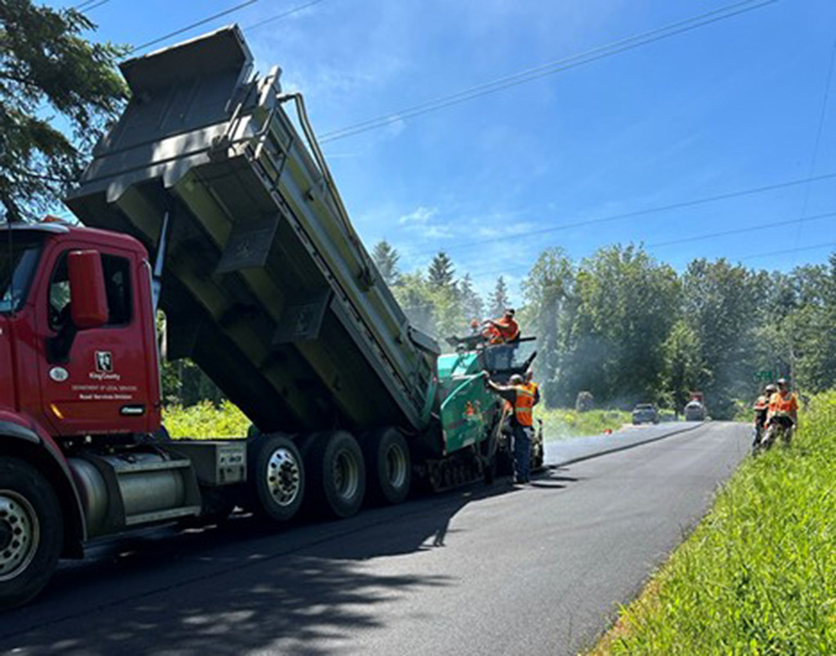 County workers paving a road in unincorporated King County. 