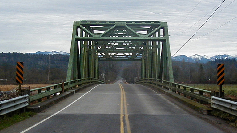 The Stossel Bridge on Carnation Farm Road NE near Carnation is a fracture-critical through-truss bridge similar to the Skagit River Bridge.