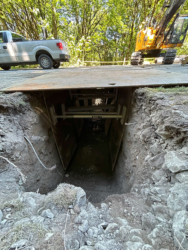 A dug out a section of the road, resembling a channel.