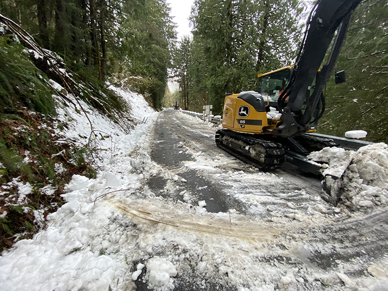 Snow on road with construction crane