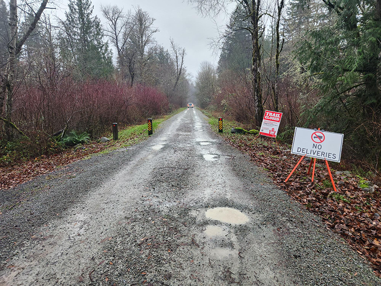 Gravel trail with closed signs