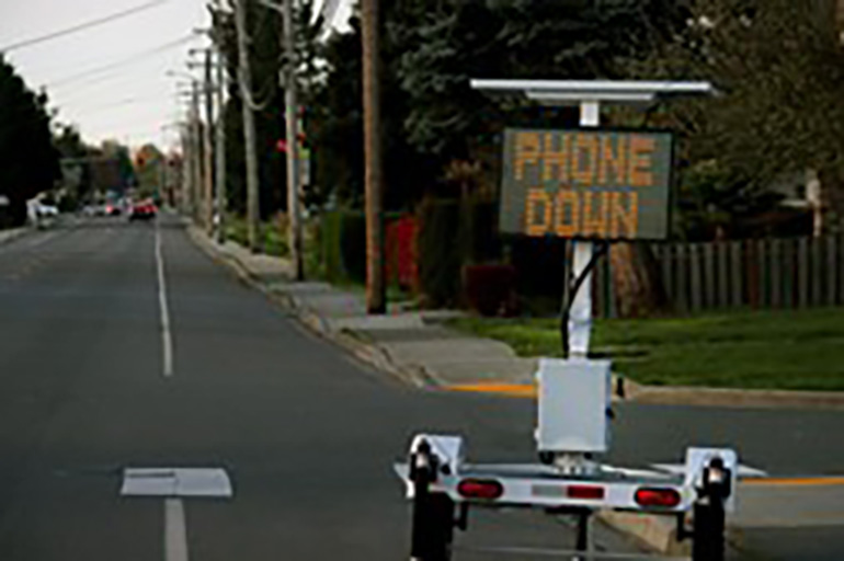 Traffic smart sign displaying "Phone Down"