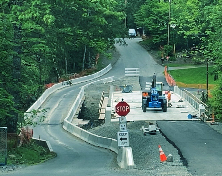 Crews work to complete the new bridge deck scheduled to open to traffic in early June 2023.