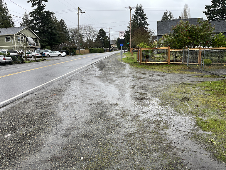 Wet gravel next to a road