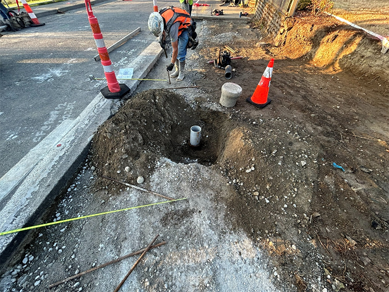 Crew member working in gravel