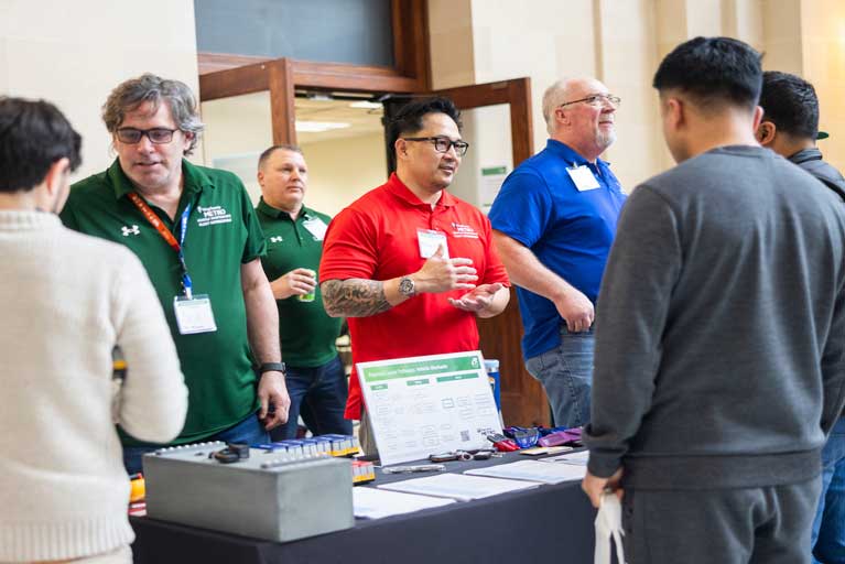 Attendees speak to Metro employees at the Green Careers Event
