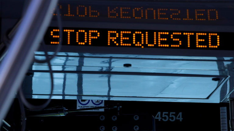 When the STOP button is pushed, the STOP REQUESTED sign at the front of the bus will light up.