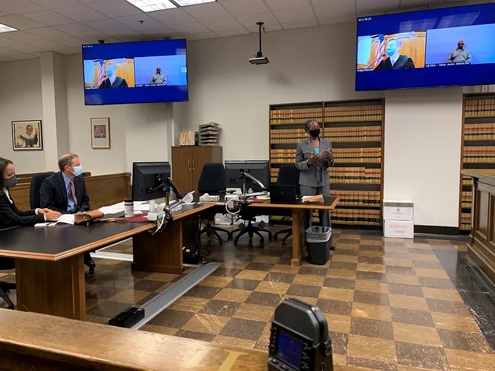 Photo from the courtroom of KCPAO Deputy Chief of Staff and Chair of the Sentence Review Unit, Carla Lee, with pro bono defense counsel from the Seattle Clemency Project.