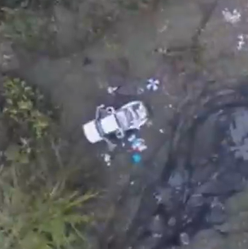 drone photo of stolen vehicles in wooded area
