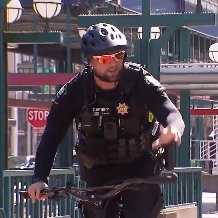 Sound Transit Deputy riding bike to patrol station