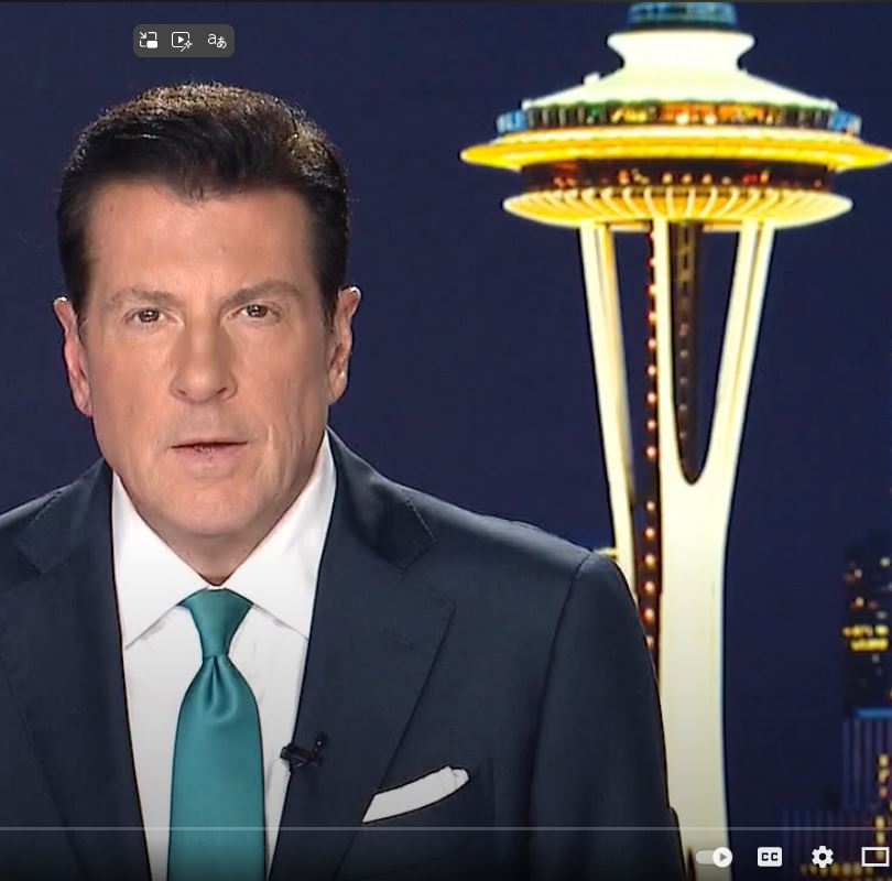 Fox 13 news anchor in front of the Space Needle