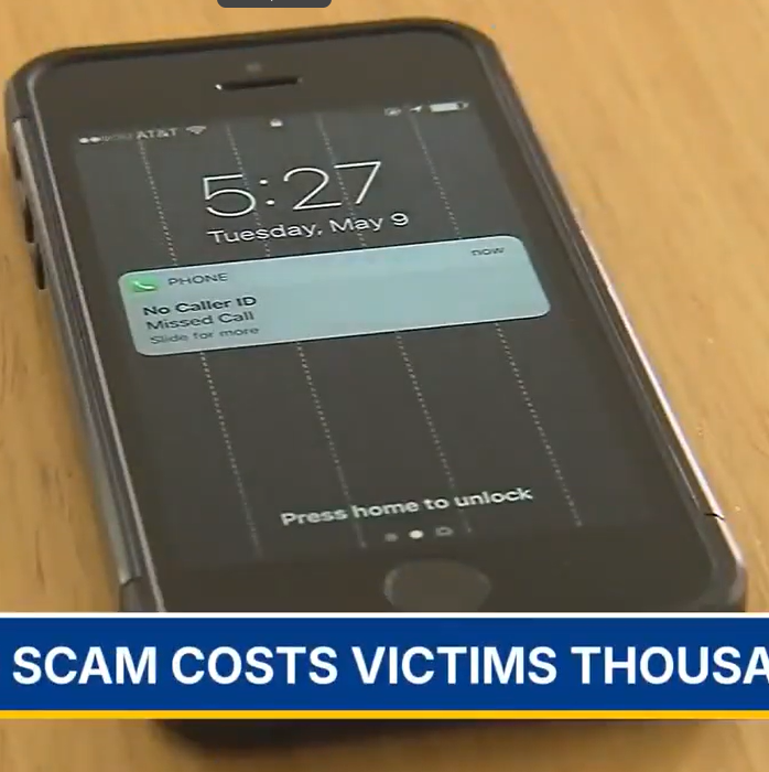 Cell phone with title Scam costs victims thousands