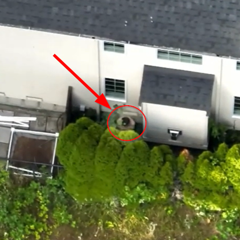 drone finds suspect hiding behind house