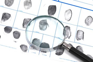 Fingerprints and magnifying glass