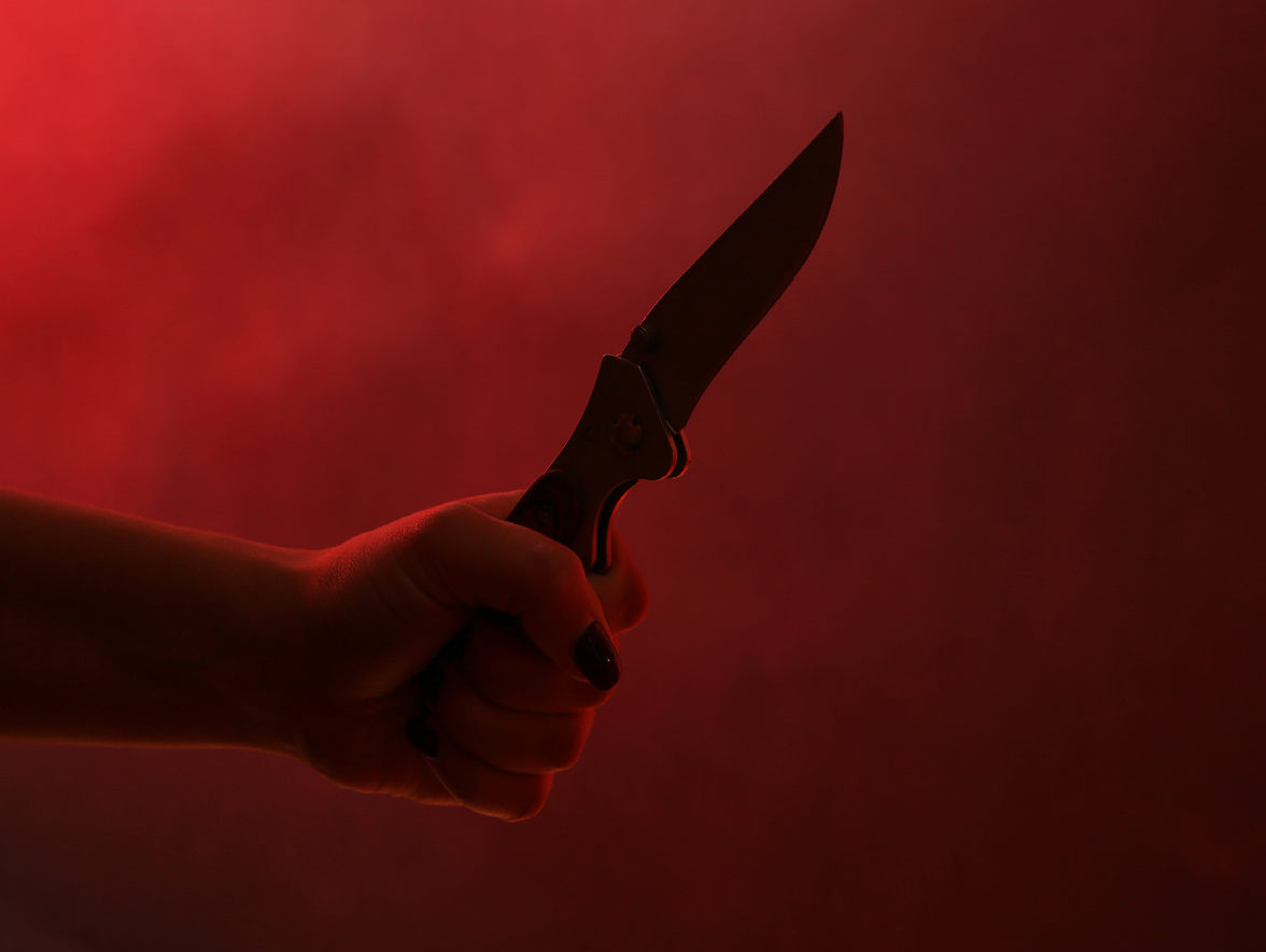 Woman's hand with knife