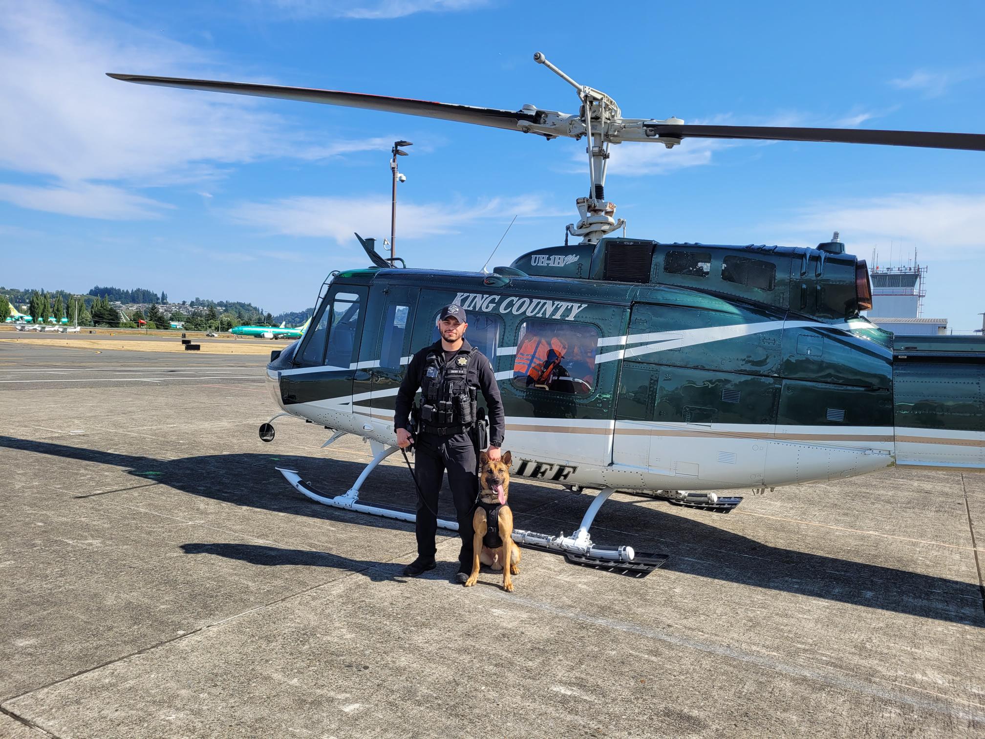 K9 and deputy repelling from helicopter
