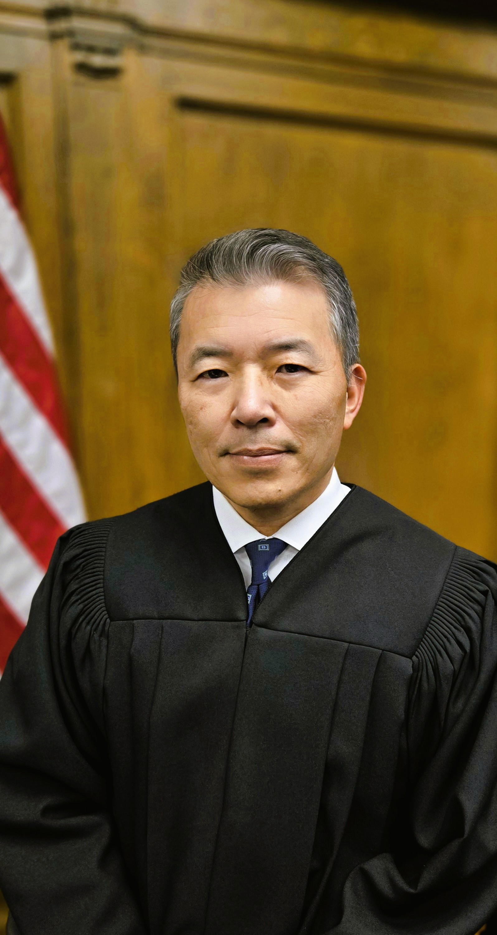 A judge in a black robe.