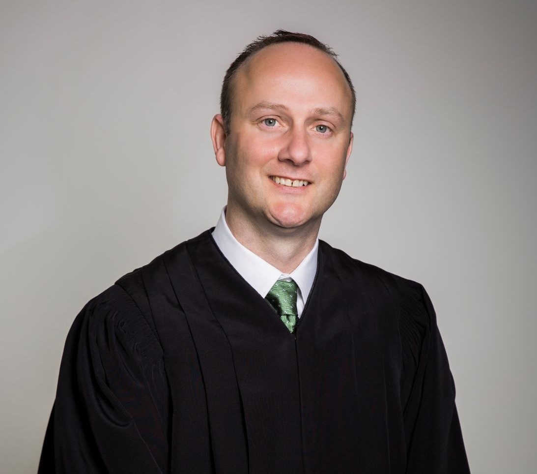 A man in a black robe