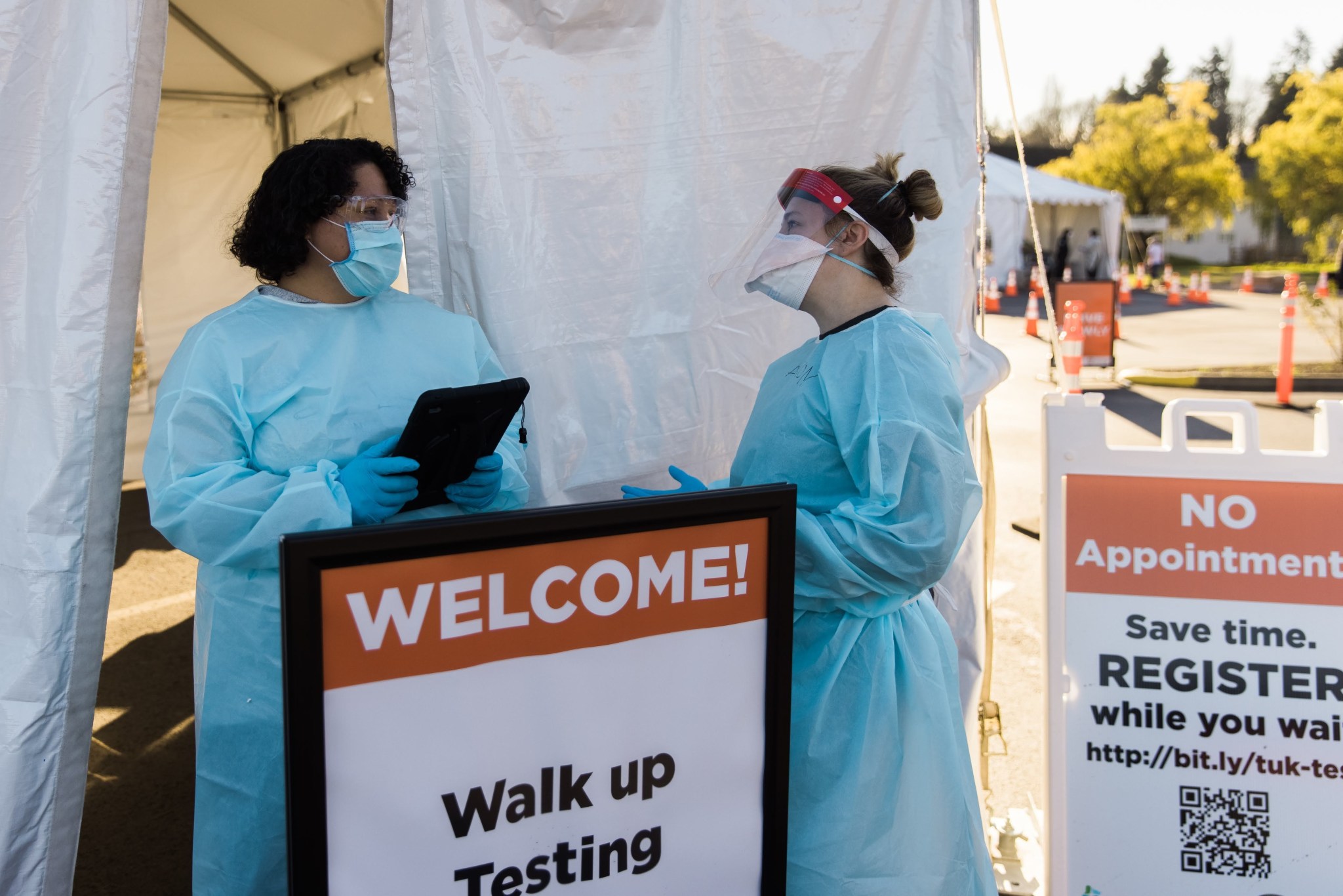 Public health workers at a walk-up COVID-19 testing site