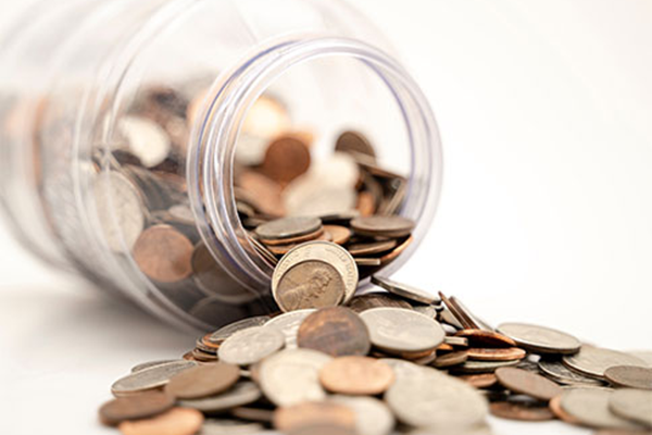 Jar of coins on its side