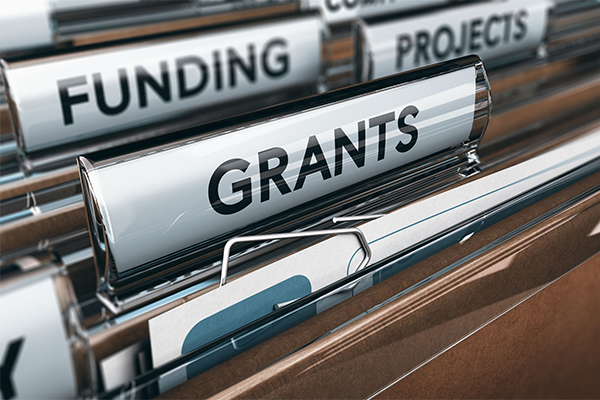Closeup image of file folder label with the text "GRANTS"